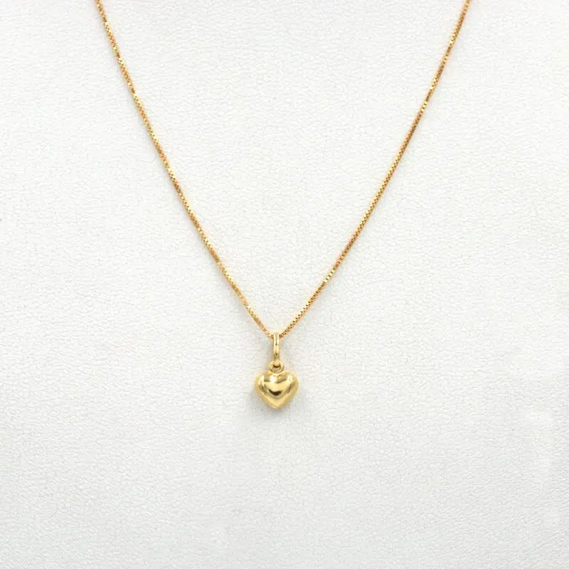 CON_CORAZONMINI Conjunto Corazón Mini de oro 18k con cadena y colgante delicado.